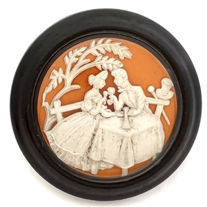 Vintage British plastic button of man and woman dining.