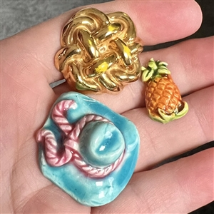 Three couture buttons by French ceramist Helene Mechin.
