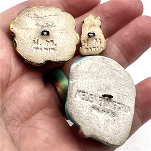 Three couture buttons by French ceramist Helene Mechin.