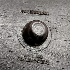 Vintage British plastic button of man and woman dining.