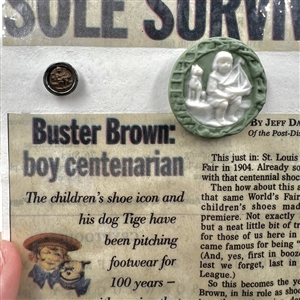 Card of five Buster Brown buttons and memorabilia.