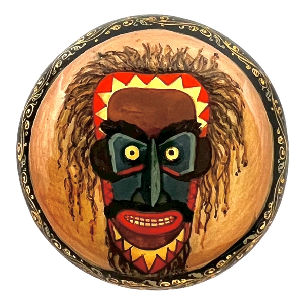 Russian lacquer button of a Lacota (Native American) mask. 