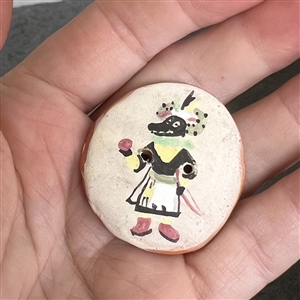 Handmade Native American pottery button of a Black Ogre Kachina.