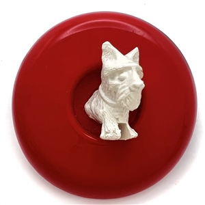 Vintage celluloid button of scotty dog jumping out of center of button.