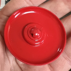 Vintage celluloid button of scotty dog jumping out of center of button.