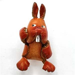 Leather button of a realistic rabbit. 