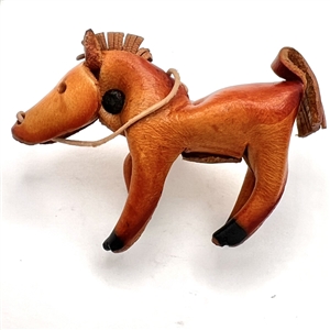 Huge leather button of a realistic horse.