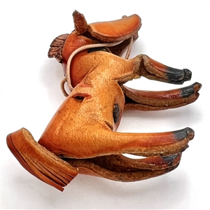 Huge leather button of a realistic horse.
