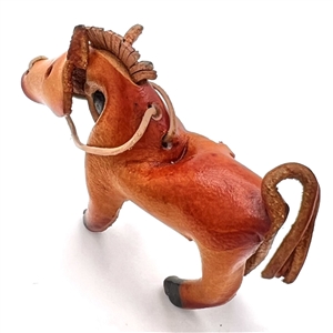 Huge leather button of a realistic horse.