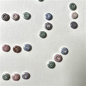 Card of forty two small china calico buttons. 