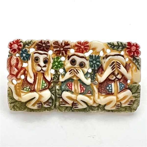 Carved and painted natural material button of "See no evil, hear no evil, speak no evil."