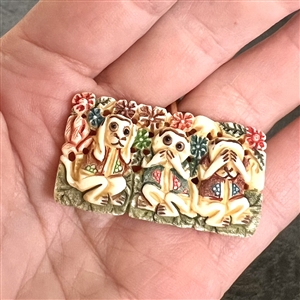 Carved and painted natural material button of See no evil, hear no evil, speak no evil.