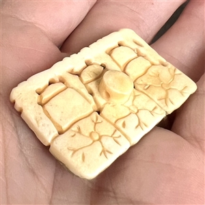 Carved and painted natural material button of See no evil, hear no evil, speak no evil.