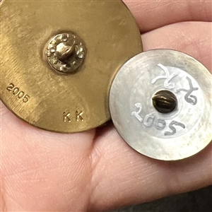 Two cold enamel studio buttons by Kevin Kinne.