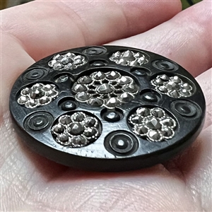 Div I - engine turned bogwood button with faceted steel rosettes.