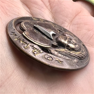 Brass button of “Chinese Tumbler.