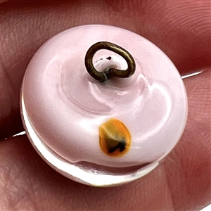 Studio glass paperweight button of a snake.