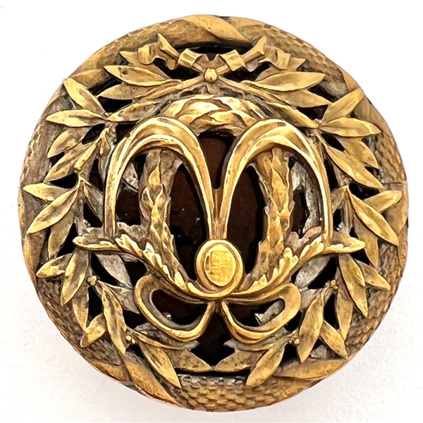A 19th c. Brass button with an enamel background.