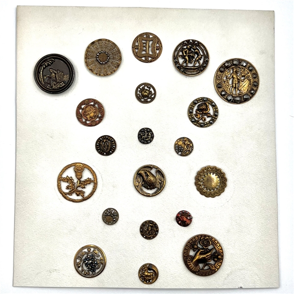 Card of 20 brass buttons of assorted subjects.