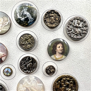 Card of 25 assorted buttons of people etc.