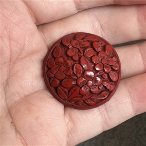 Chinese cinnabar button of flowers. 