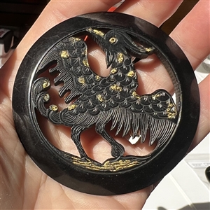 Huge carved casein button of a rooster.