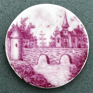 A 19th c. Porcelain button of a city scene with bridge.