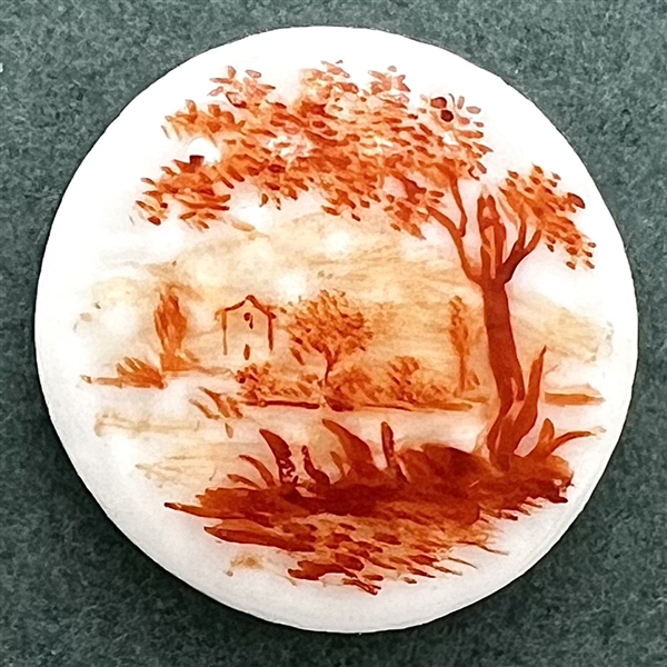 A 19th c. Mennecy porcelain button  of a river scene.