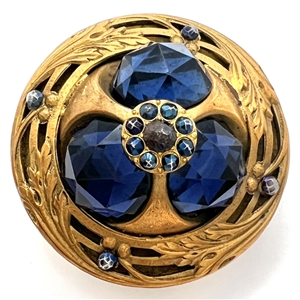 Gorgeous and unique true Gay 90s button with three faceted blue glass jewels and blued steels.