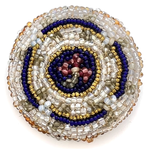 A 19th c. Beaded fabric button.