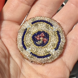 A 19th c. Beaded fabric button.