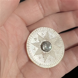 An 18th c. pearl with center star and paste.