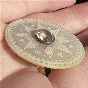 An 18th c. pearl with center star and paste.