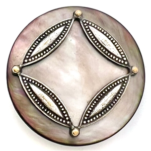 A 19th c. grey pearl button with metal design.