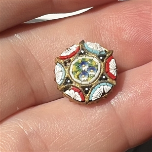 Italian mosaic button with center of flowers.