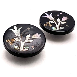 Matched pair of horn buttons with inlay of tulips.