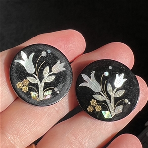 Matched pair of horn buttons with inlay of tulips.