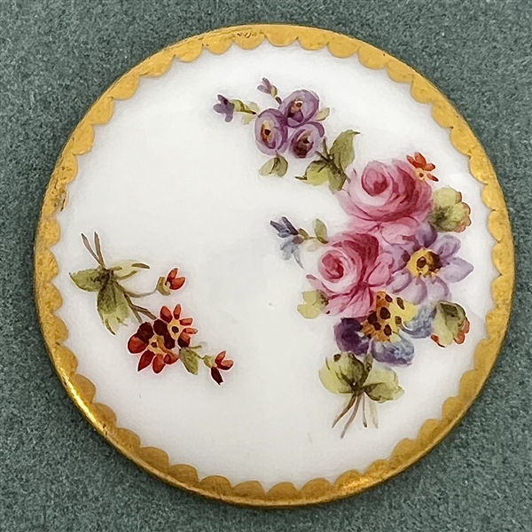 A 19th c. Porcelain button of flowers with Sevres back mark.