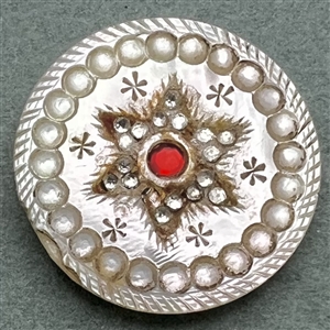 An 18th c. pearl with star motif, pastes and red paste center.