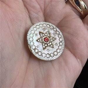 An 18th c. pearl with star motif, pastes and red paste center.