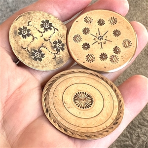 Three 18th c. chased copper colonial buttons.