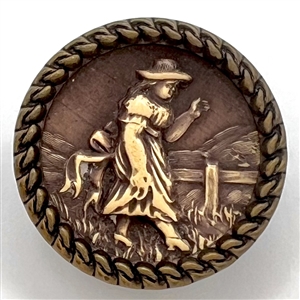 “Victorian Girl" Ivoroid button mounted in brass.