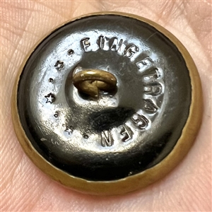 “Victorian Girl Ivoroid button mounted in brass.