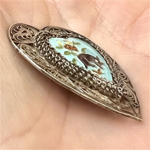 Adorable enamel cat and plant life set in silver (?) filigree heart.