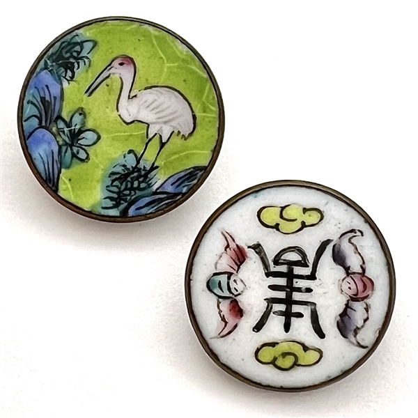 Two enamel buttons of birds.