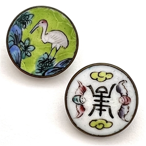 Two enamel buttons of birds.