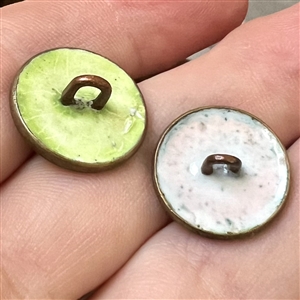 Two enamel buttons of birds.