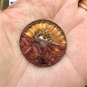 Lacy glass button of a “Sunrise.