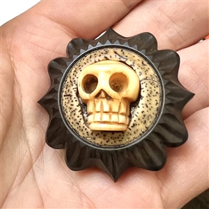Skull and carved African blackwood studio button by Jon Sauer.