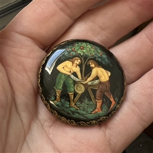 Russian lacquer button of two men sawing - NBS show favor button 2004.